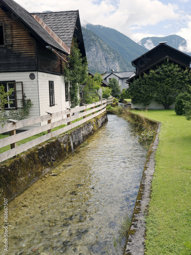 Town Hallstatt with mountain lake and salt mines. Alpine massif, beautiful canyon in Austria. Salzburg Alpine valley in summer, clear water. Destination for vacation, hiking and relaxation.
