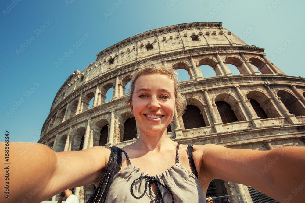 Woman on the background of the Colosseum