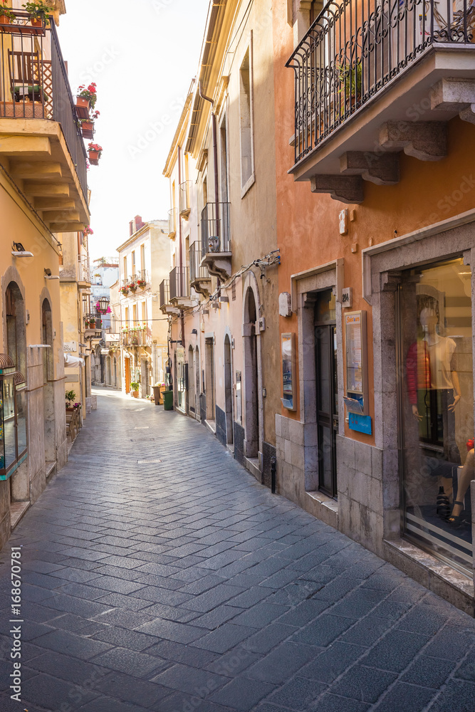 Romantic street of Corso Umberto in beautiful town of Taormina, Sicily island, Italy