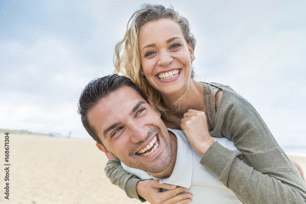 portrait of living young couple at the beach portrait of living young couple at the beach
