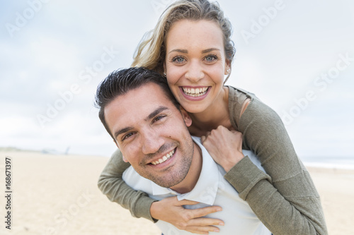 portrait of living young couple at the beach
