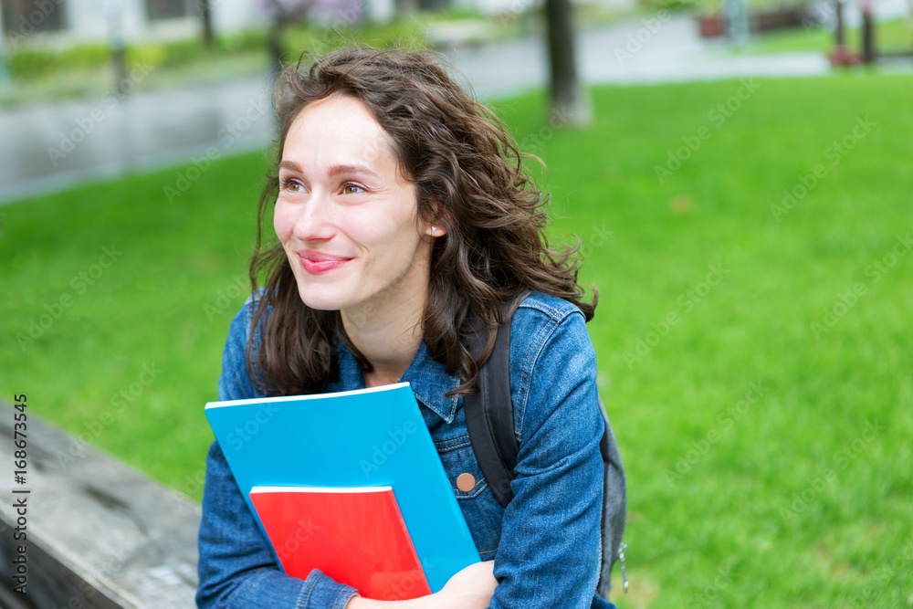 Portrait of a young student with backpack going to school and holding notebook - Back to school Portrait of a young student with backpack going to school and holding notebook - Back to school
