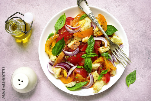 Panzanella - traditional italian tomato salad with bread and onion.Top view.