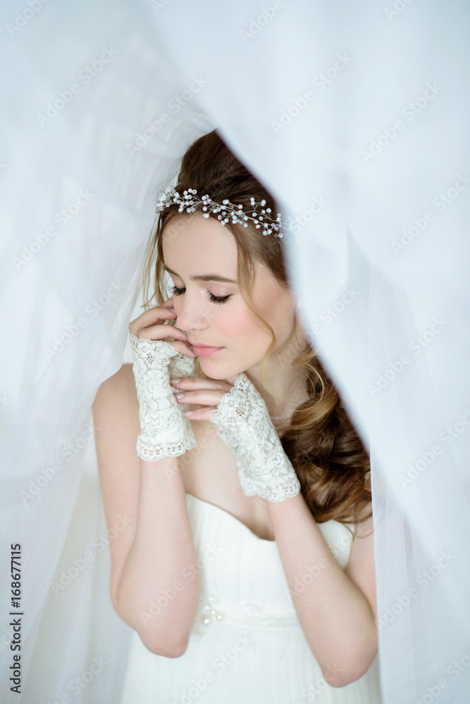Brunette bride in fashion white wedding dress with makeup Brunette bride in fashion white wedding dress with makeup