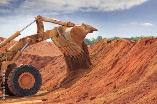 one bulldozer at Weipa bauxite mine photo