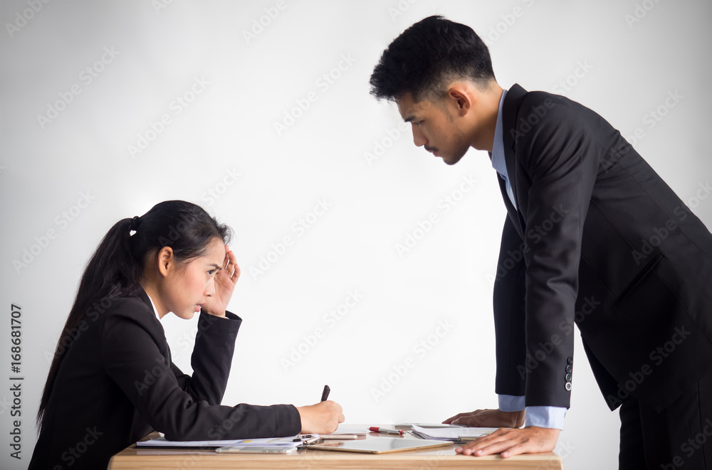 Aggressive/angry boss complaining asian business woman(casual uniform) in cafe office Aggressive/angry boss complaining asian business woman(casual uniform) in cafe office