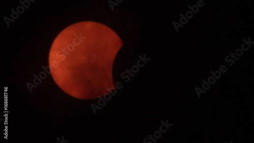 time-lapse of solar eclipse 2017 with passing clouds (beginning phase)