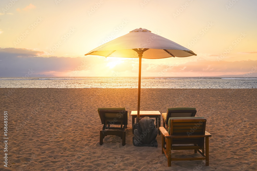 Stunning beautiful sunlight beach with relaxing scenery on a beach. Famous travel destination in Sanur, Bali, Indonesia.