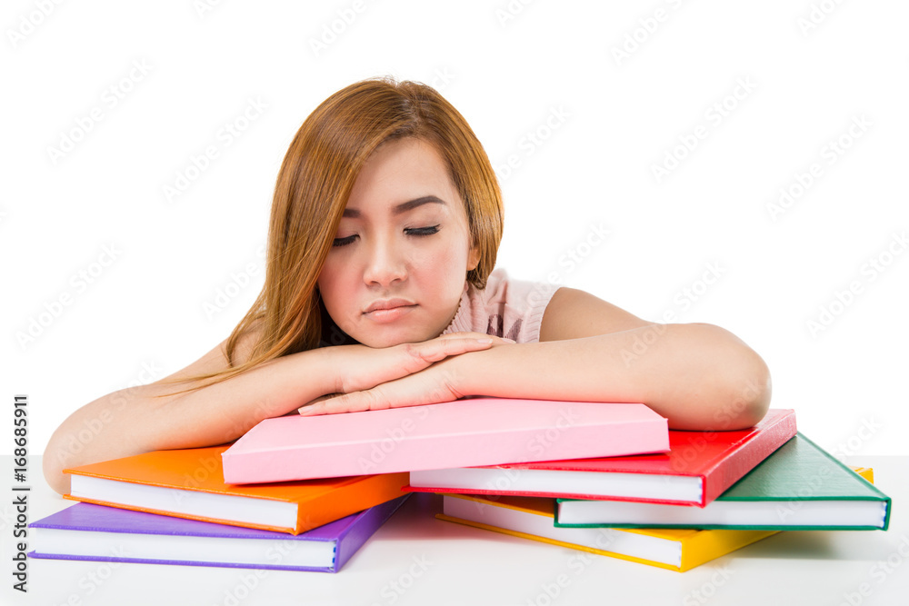 Tired student girl with books isolated on white background Tired student girl with books isolated on white background