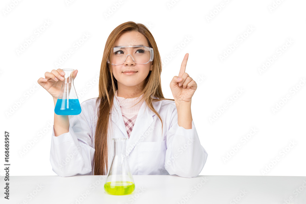 Asian scientific researcher holding at a liquid solution in a lab Asian scientific researcher holding at a liquid solution in a lab