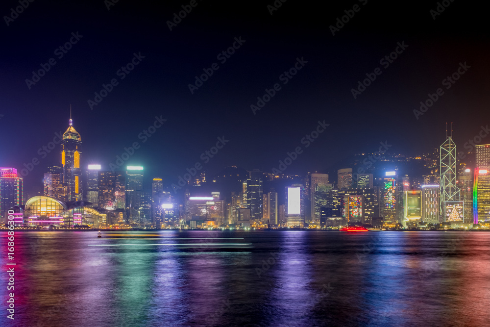 Hong Kong skyline view from kowloon side,colorful night life,cityscape and reflection on water