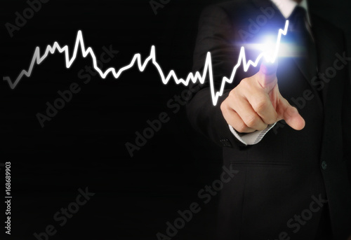 hand with stock financial chart symbols coming from hand