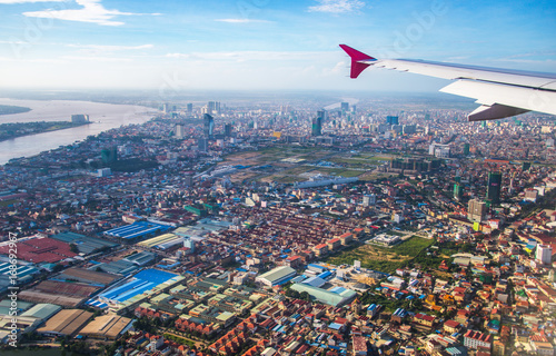 The cityscape view of Phnom Penh City from the window of airplane