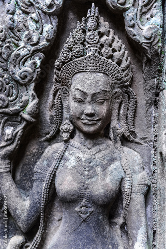 Detail of stone carvings of Apsara is a beautiful and seductive girl of Hindu mythology at Angkor Wat  Cambodia
