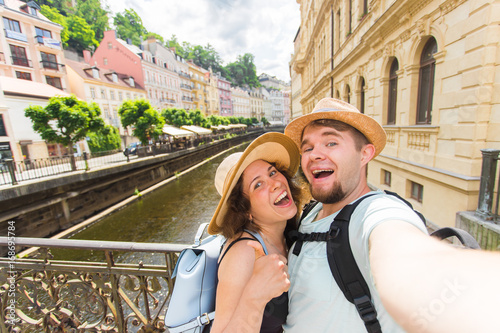 Photography Happy romantic couple of tourists makes selfie self-portrait in Karlovy Vary while traveling across Europe