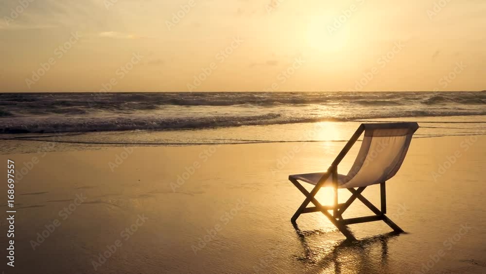 Beach chair on a beautiful sunset beach Beach chair on a beautiful sunset beach