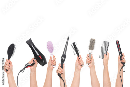 Photo hands holding hairdressing tools