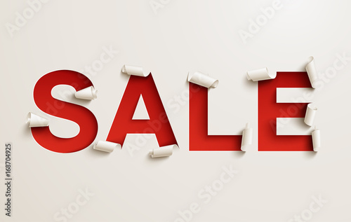 Sale banner. Cut out curled white paper over a red background photo