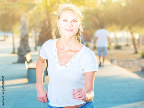 Sportswoman is jogging in the park