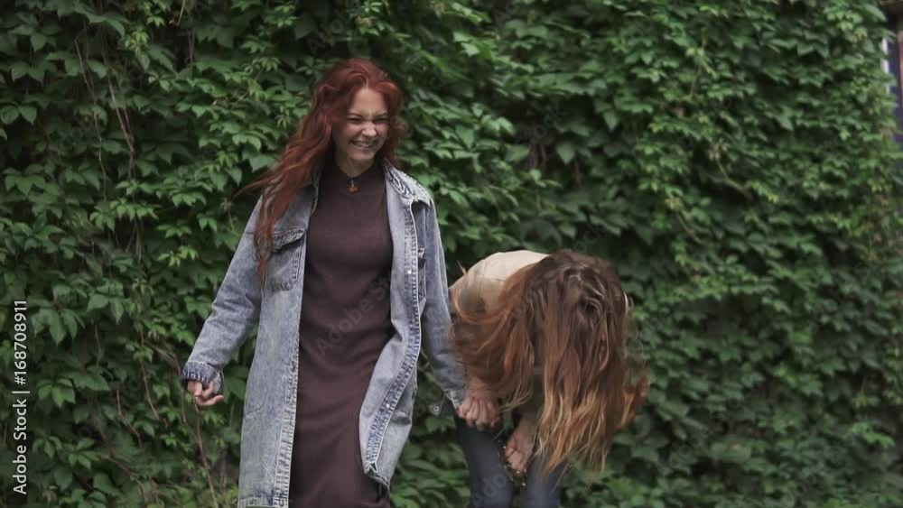 redheads girlfriends laughing and having fun. slow motion