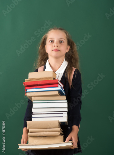 Back to school and homework concept. Girl in classroom