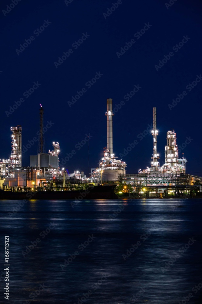 Oil refinery plant near river at twilight, Business and  Industry concept