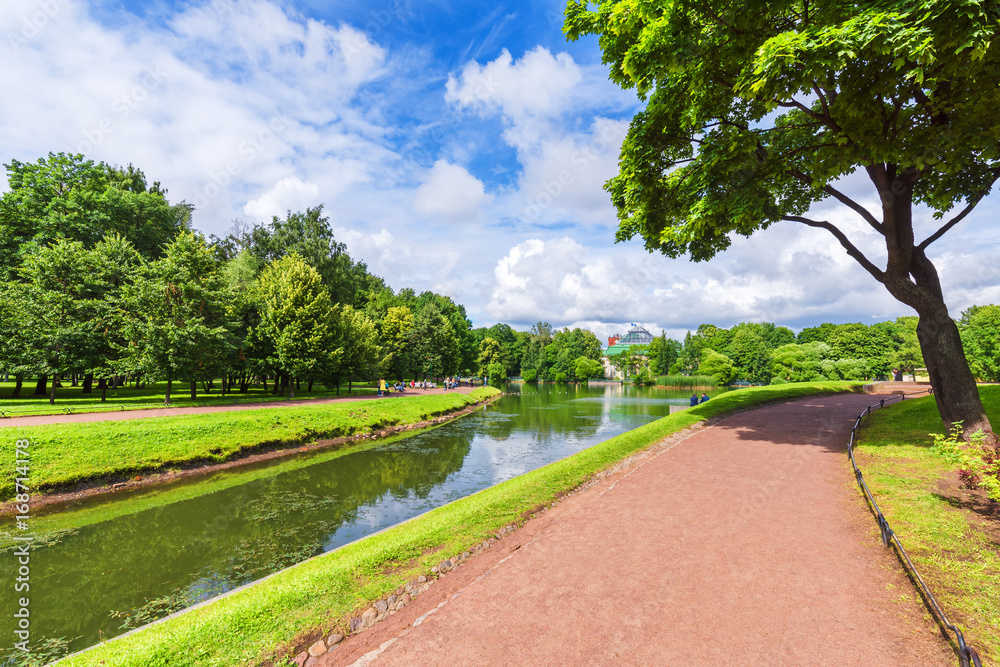 Obraz premium City park with walks for walks, trees and canals