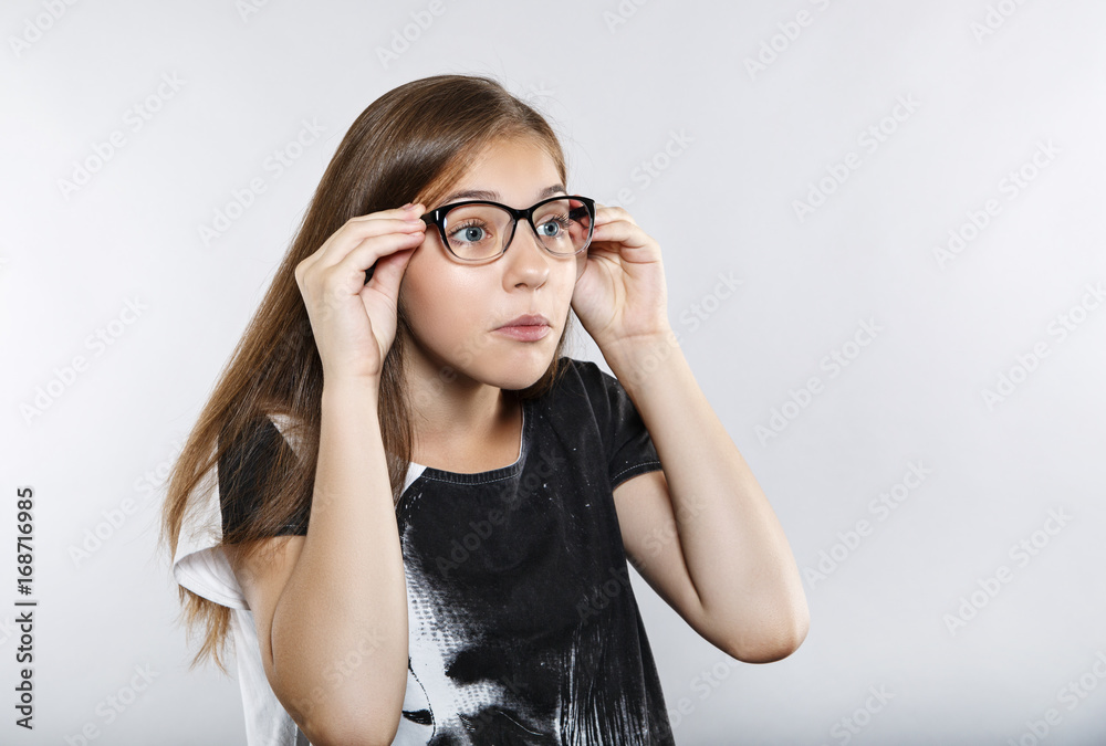 Funny girl with glasses. Human emotions. Surprise Funny girl with glasses. Human emotions. Surprise