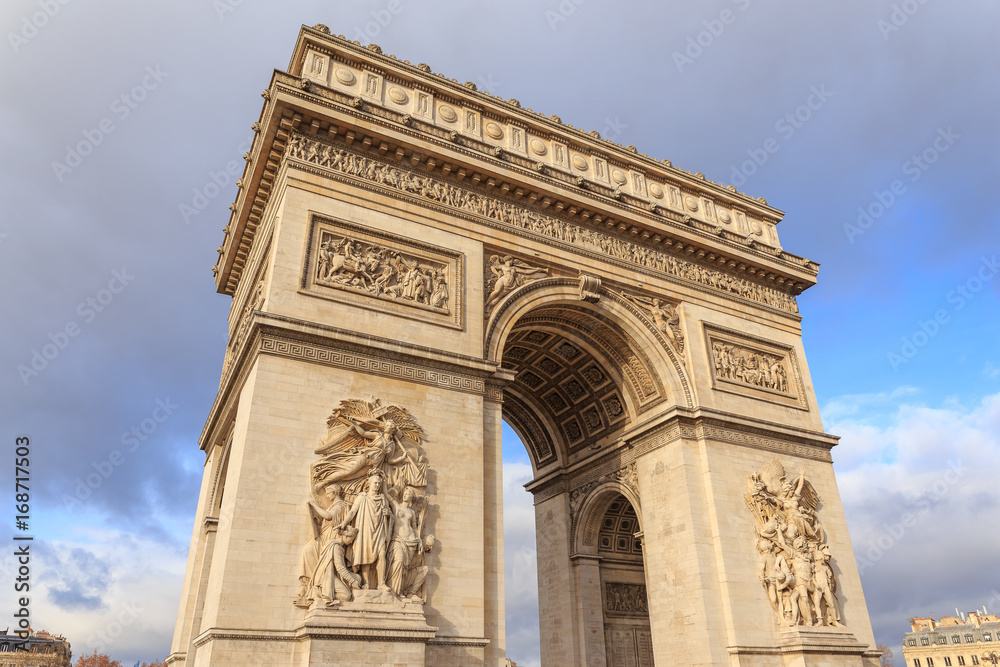 PARIS, FRANCE : The Arc de Triomphe de l'Etoile is one of the most famous monuments, View of the Champs-Elysees Avenue is full of stores, cafes and restaurants.