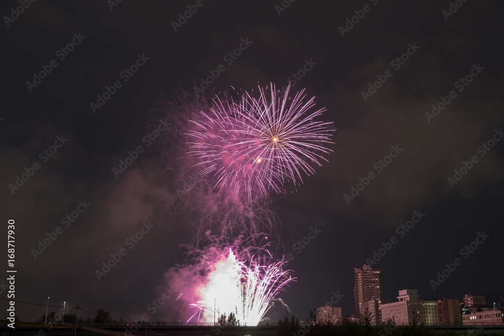 Toyohira River Fireworks, this festival is regarded as Hokkaido most popular fireworks festival over 4000 fireworks light up the night sky over Sapporo, Japan. Image show noise due night shot.