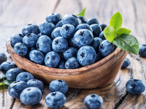 Wallpaper Mural Blueberries in the wooden bowl on the table. Torontodigital.ca