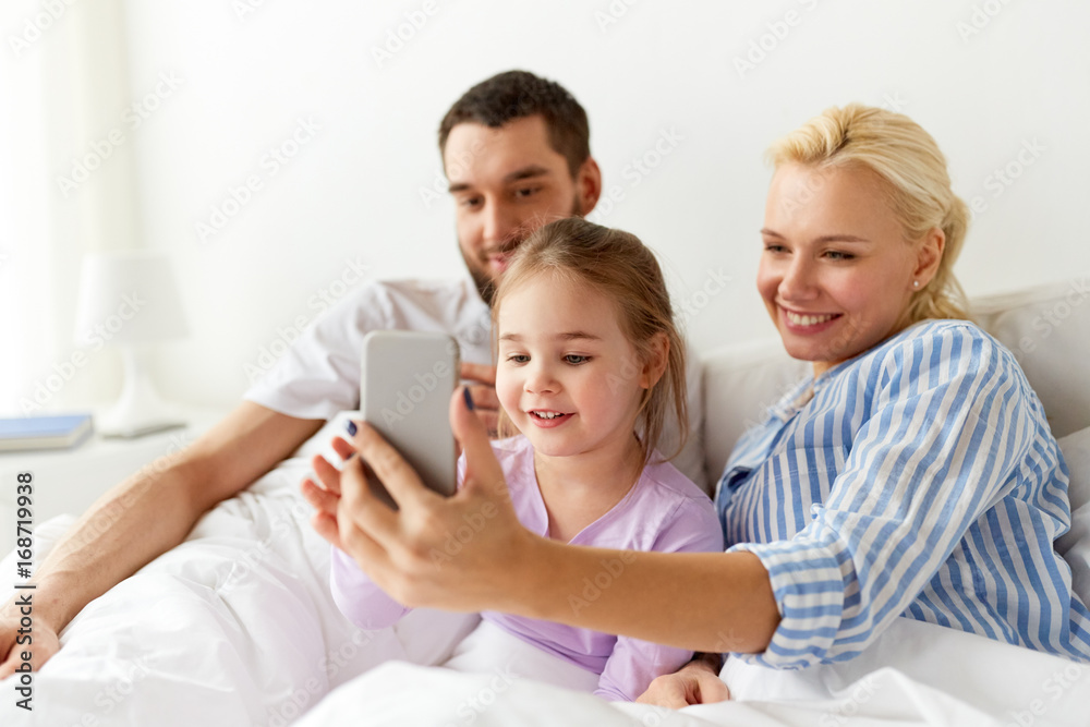 happy family with  smartphone at home