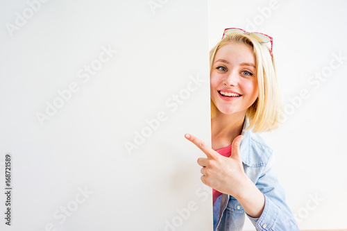 Stylish girl pointing at something