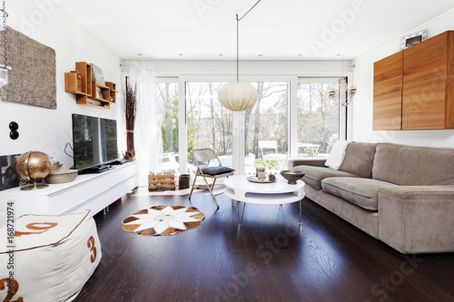 fancy living room with dark wooden floor and big window