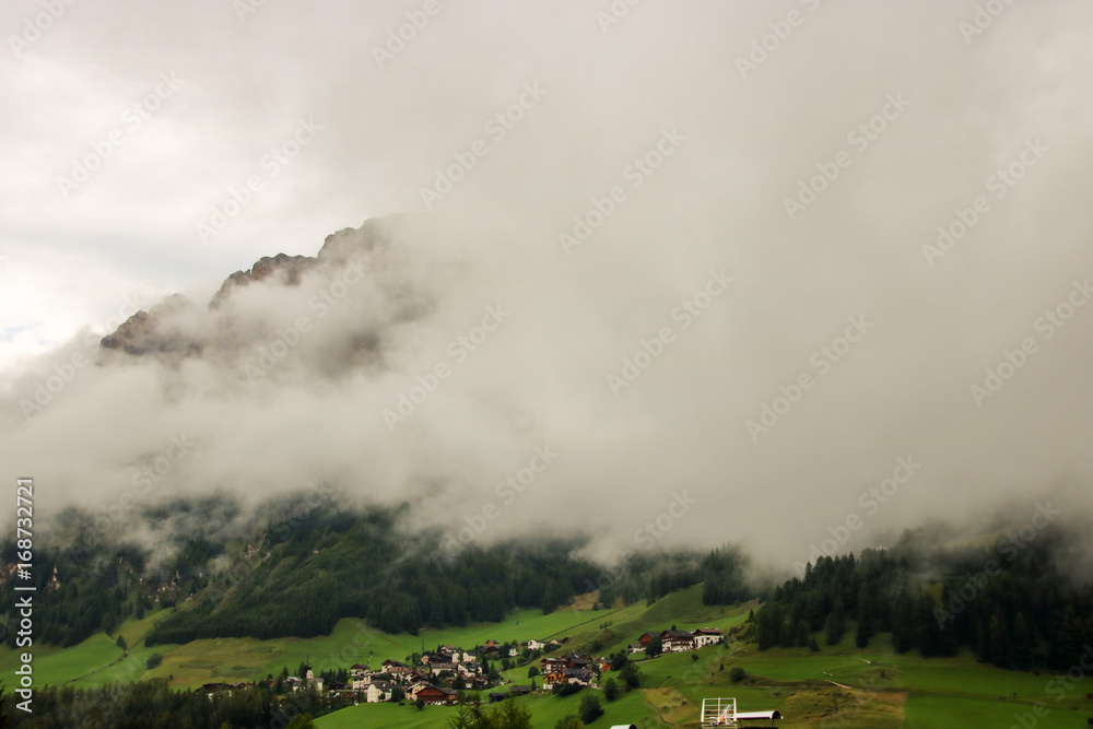 Misty and cloudy alpine landscape