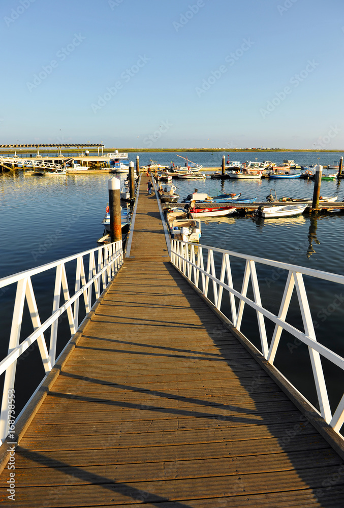 Obraz premium Jetty at the Olhao Marina, Ria Formosa Natural Park, Algarve, Portugal