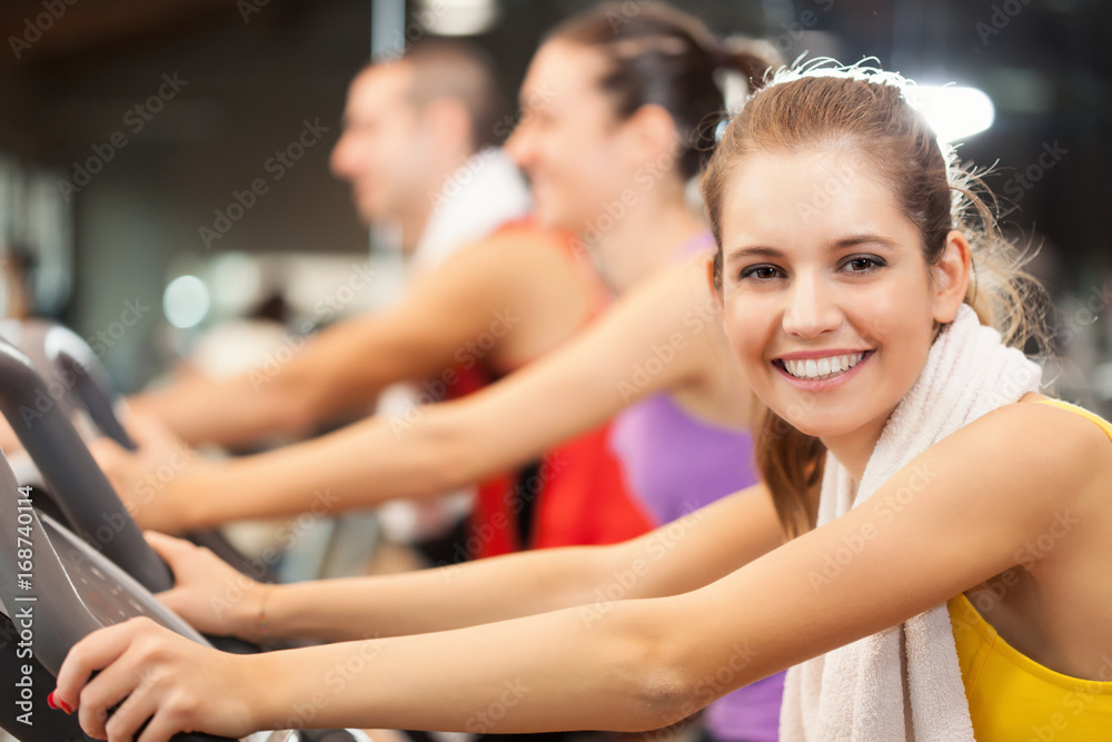 Portrait of a smiling woman in a gym