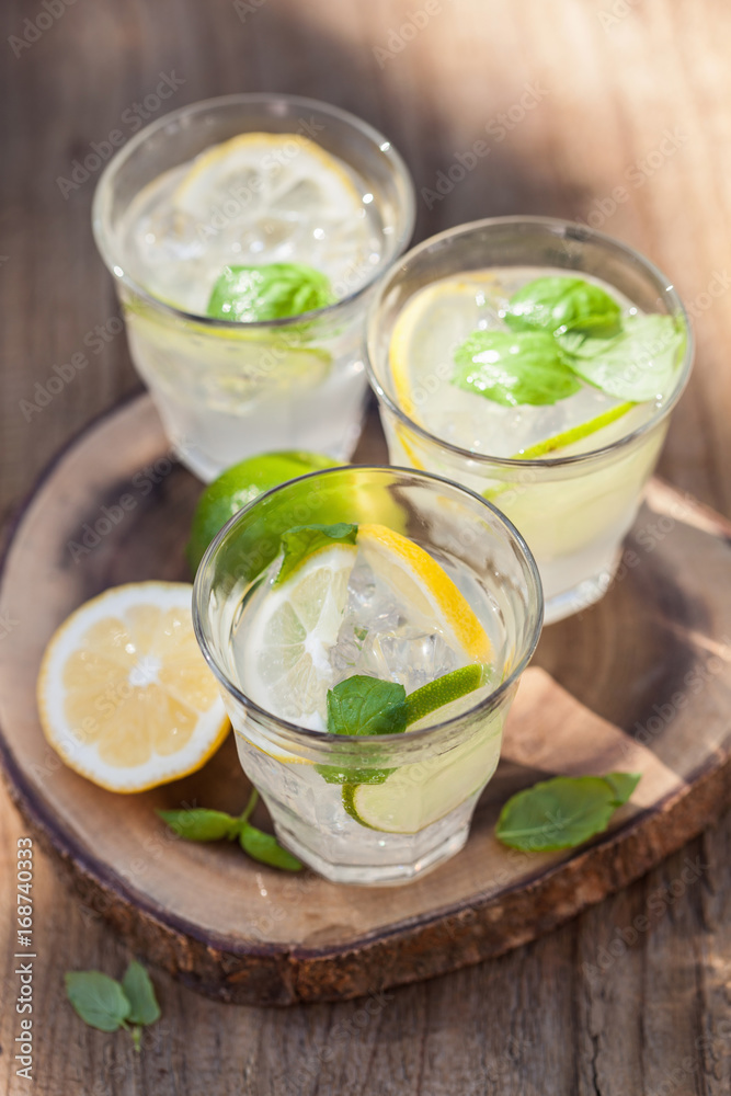 refreshing lemonade drink with mint lime lemon in garden refreshing lemonade drink with mint lime lemon in garden