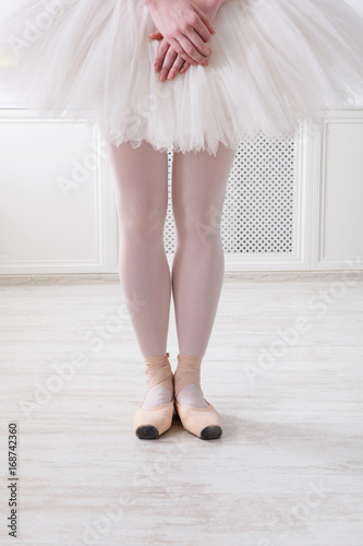 Ballerina legs closeup in sixth position