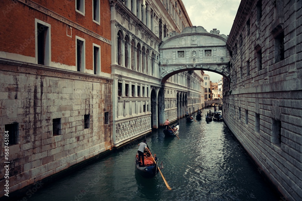 Gondola in canal with Bridge of Signs