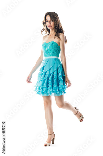 Beautiful woman in turquoise cocktail dress in motion © GVS