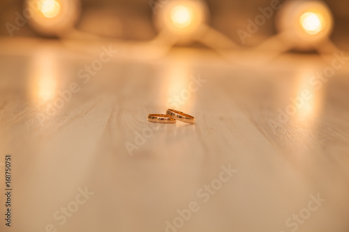 Gold rings honeymoon on the texture © izida1991