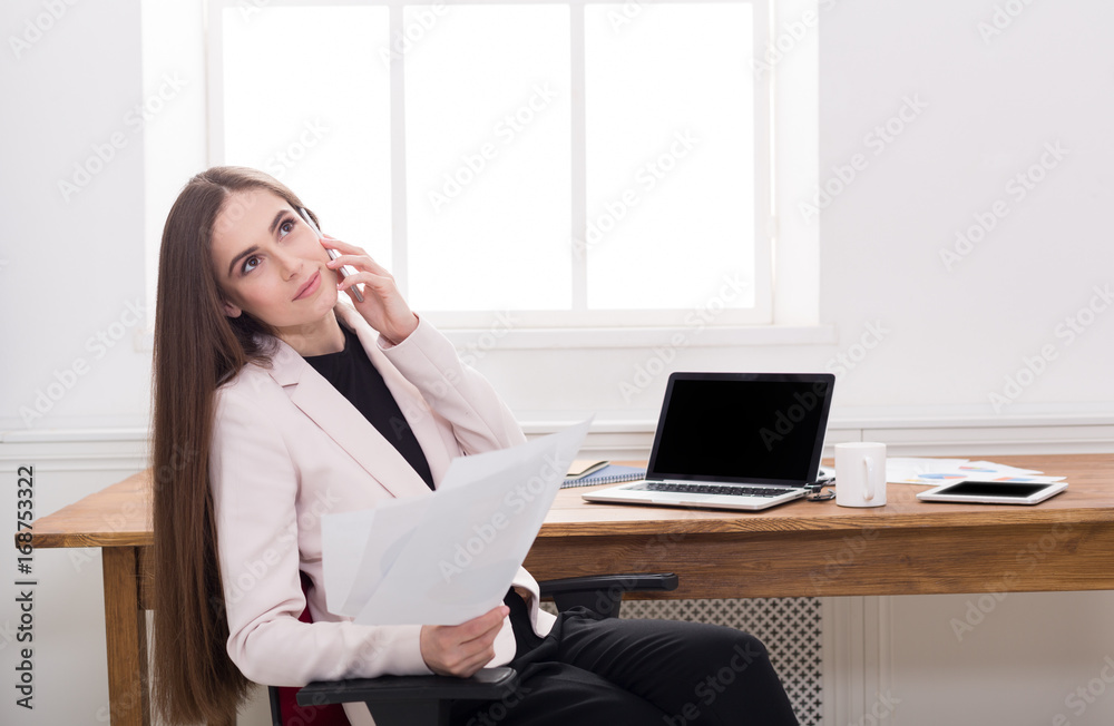 Business talk, woman consulting by phone at office Business talk, woman consulting by phone at office