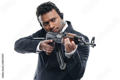 african american bodyguard with rifle