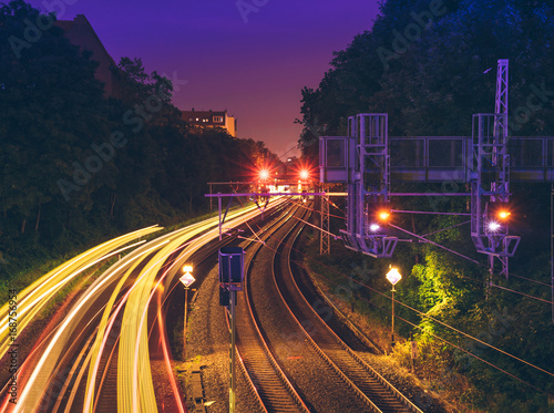 Photography beautiful train rails with traffic lights at night