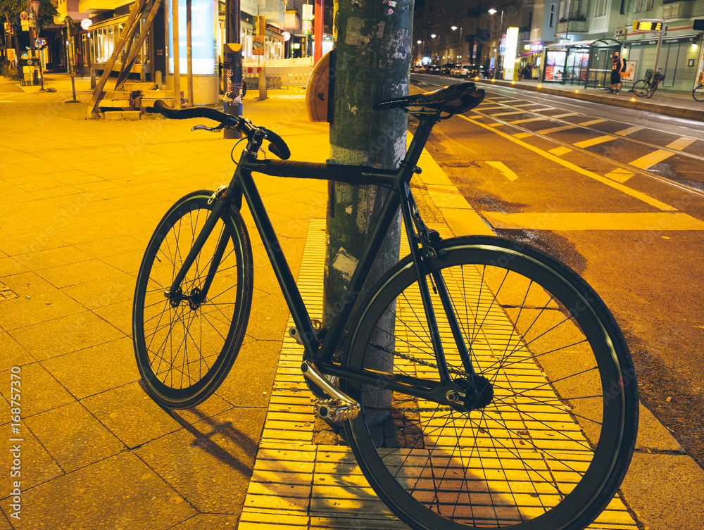 black fixie or singlespeed bike at night
