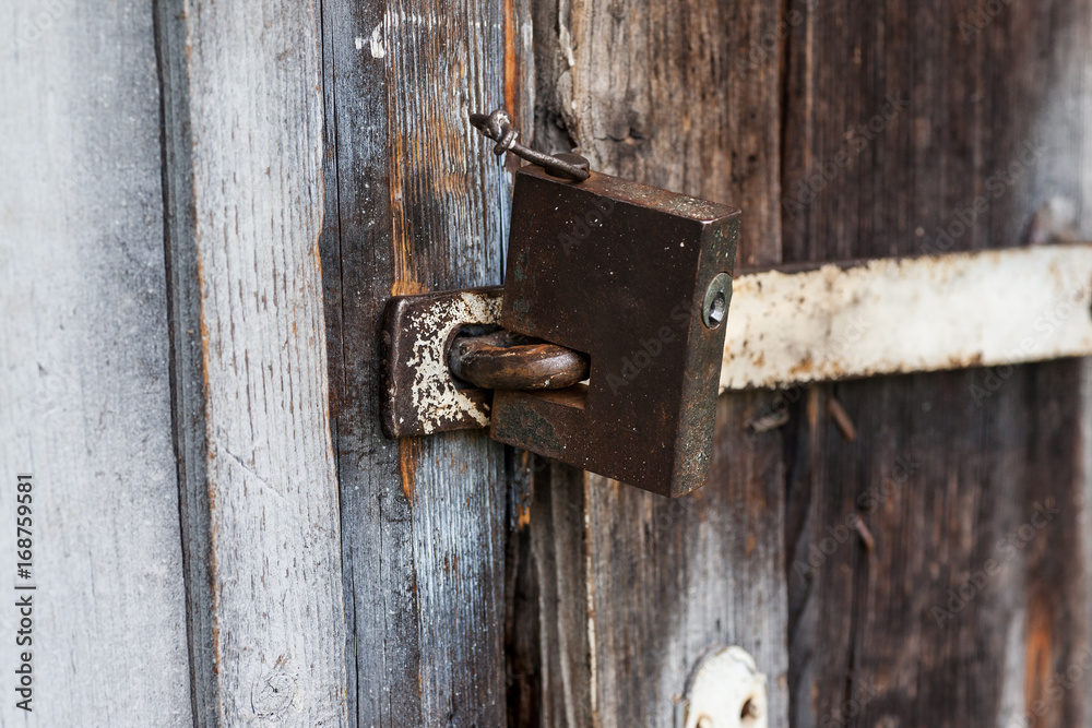 Closeup shot of an old metal lock, selective focus Closeup shot of an old metal lock, selective focus