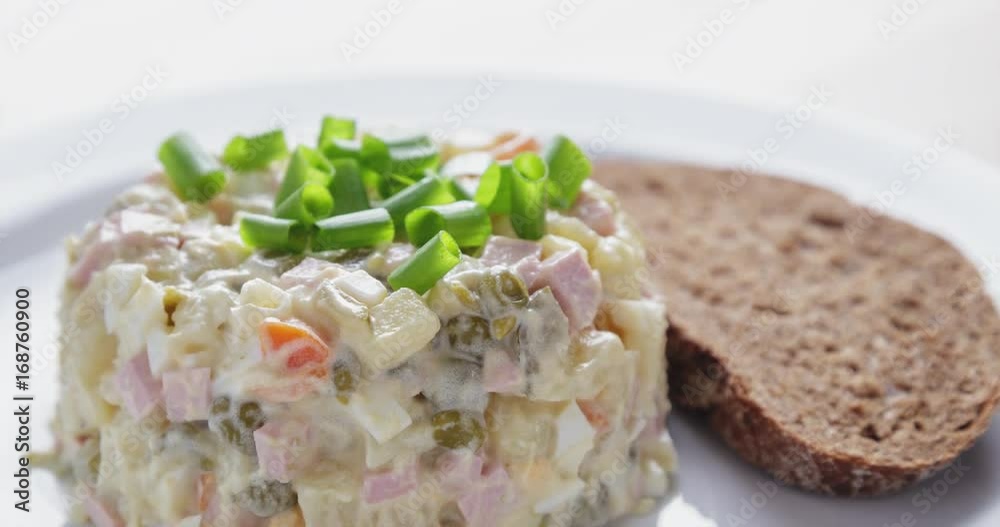 russian salad olivier served with onion russian salad olivier served with onion