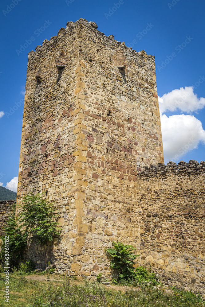Old ancient stone walls and towers of the fortress.