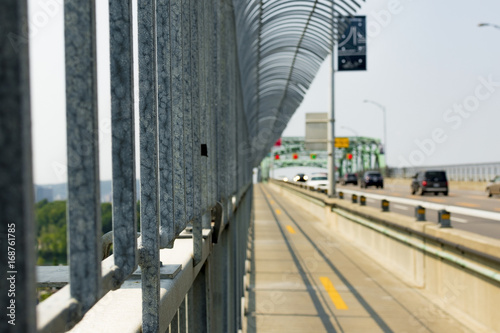 Close up of a bridge fence with a blured background